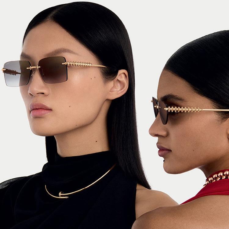 Two female models wearing the new Cartier Clash rimles frames.
