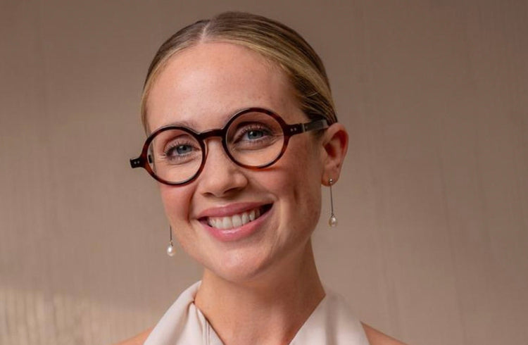 Female model wearing Lunor round eyeglasses