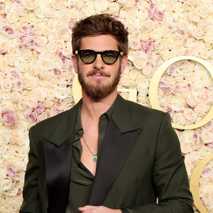 Andrew Garfield wearing tinted sunglasses at the 2025 Golden Globes